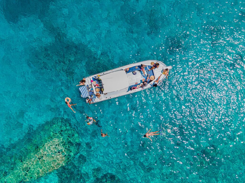 Your Guide to Whale Shark Season in Seychelles 1 Aerial view of a boat and snorkellers in turquoise Seychelles waters