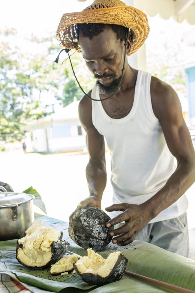 Preparing roasted breadfruit for a traditional Creole meal